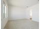 Light bedroom with carpet, a side window and ensuite bath with wood-look tile at 4780 W Flat Iron Ct, Queen Creek, AZ 85144