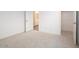 Carpeted bedroom with an open closet and a doorway at 4780 W Flat Iron Ct, Queen Creek, AZ 85144