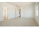 Inviting bedroom featuring plush carpeting, and easy access to the bathroom and kitchen at 4780 W Flat Iron Ct, Queen Creek, AZ 85144
