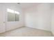 Bright bedroom with carpet flooring and a window at 4780 W Flat Iron Ct, Queen Creek, AZ 85144