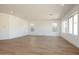 Expansive living area with recessed lighting, wood-look tile flooring and large windows at 4780 W Flat Iron Ct, Queen Creek, AZ 85144