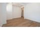 Cozy room featuring stylish wood-look tile floors and neutral white walls at 4780 W Flat Iron Ct, Queen Creek, AZ 85144