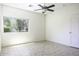 Bright and airy bedroom with a large window and neutral tile flooring at 846 N Pueblo Dr # 110, Casa Grande, AZ 85122