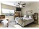 Charming bedroom with a queen-size bed, ceiling fan, and decorative accents at 846 N Pueblo Dr # 110, Casa Grande, AZ 85122