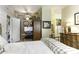 Bright bedroom with a queen-size bed, private office space, and ensuite bathroom at 846 N Pueblo Dr # 110, Casa Grande, AZ 85122