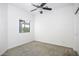 Bright bedroom featuring a ceiling fan and a window letting in natural light at 846 N Pueblo Dr # 110, Casa Grande, AZ 85122