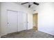 Bedroom featuring a ceiling fan, carpet, and closet with sliding doors at 846 N Pueblo Dr # 110, Casa Grande, AZ 85122