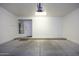 Single-car garage with bright lighting and a water heater, providing functional space at 846 N Pueblo Dr # 110, Casa Grande, AZ 85122