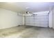 Spacious one car garage featuring an automatic door and a clean, concrete floor at 846 N Pueblo Dr # 110, Casa Grande, AZ 85122