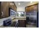 Kitchen with stainless steel appliances, window view, and granite countertops at 846 N Pueblo Dr # 110, Casa Grande, AZ 85122