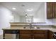 Open-concept kitchen with granite countertops and a view of the living area at 846 N Pueblo Dr # 110, Casa Grande, AZ 85122