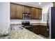 Well-equipped kitchen features stainless steel appliances, granite countertops, and ample cabinetry at 846 N Pueblo Dr # 110, Casa Grande, AZ 85122