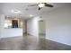Open living room featuring tile floors, ceiling fan, and open access to the kitchen at 846 N Pueblo Dr # 110, Casa Grande, AZ 85122
