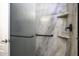 Shower interior featuring sleek glass doors and shelving for toiletries at 846 N Pueblo Dr # 110, Casa Grande, AZ 85122