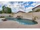 Kidney-shaped pool with waterfall feature in a private backyard at 7216 W Judy Lynn Ln, Peoria, AZ 85382