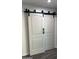 Modern barn doors add a touch of elegance and privacy to this home's interior at 4330 W Mescal St, Glendale, AZ 85304