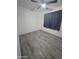 This bedroom offers modern vinyl floors and a ceiling fan for optimal comfort at 4330 W Mescal St, Glendale, AZ 85304