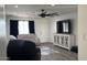 Cozy living room with ceiling fan, tv, and a stylish decorative cabinet at 4330 W Mescal St, Glendale, AZ 85304