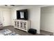 This modern living room has a large screen TV and sleek white cabinet at 4330 W Mescal St, Glendale, AZ 85304