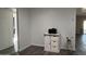 Bright living room with modern gray floors and stylish white storage cabinet at 4330 W Mescal St, Glendale, AZ 85304
