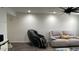Relaxing living area features a comfortable gray sofa and luxury massage chair at 4330 W Mescal St, Glendale, AZ 85304