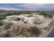 Modern desert home exterior features stone accents and native landscaping in a serene setting at 8386 E Leaning Rock Rd, Scottsdale, AZ 85266