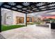 Picturesque backyard boasts a stylish pergola, outdoor fireplace, and manicured artificial turf at 8386 E Leaning Rock Rd, Scottsdale, AZ 85266