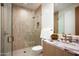 Elegant bathroom featuring a glass shower, marble countertop, modern fixtures, and neutral tile at 8386 E Leaning Rock Rd, Scottsdale, AZ 85266