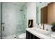 Modern bathroom with mosaic tile shower, marble countertop vanity, and bronze plumbing fixtures at 8386 E Leaning Rock Rd, Scottsdale, AZ 85266