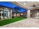 Serene courtyard showcases a well-manicured lawn, travertine patio, and minimalist home design at 8386 E Leaning Rock Rd, Scottsdale, AZ 85266