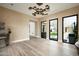 Inviting entryway with sleek light fixture, hardwood floors, and views of the beautifully landscaped yard at 8386 E Leaning Rock Rd, Scottsdale, AZ 85266
