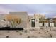 Contemporary stucco and stone home with desert landscaping and plenty of natural light at 8386 E Leaning Rock Rd, Scottsdale, AZ 85266