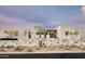 Attractive, modern home with stone accents and desert landscaping in a warm and inviting setting at 8386 E Leaning Rock Rd, Scottsdale, AZ 85266
