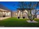 Contemporary home exterior with artificial turf, manicured landscaping, and unique architectural design at 8386 E Leaning Rock Rd, Scottsdale, AZ 85266