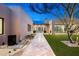 Charming front yard with a desert landscape, modern architecture, and a travertine walkway at 8386 E Leaning Rock Rd, Scottsdale, AZ 85266