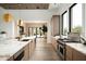 Bright, modern kitchen with stainless steel appliances, marble countertops, and wood cabinets at 8386 E Leaning Rock Rd, Scottsdale, AZ 85266