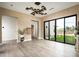Spacious living room with hardwood floors, modern chandelier, and patio doors at 8386 E Leaning Rock Rd, Scottsdale, AZ 85266