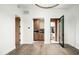Open-concept living space with hardwood floors and a seamless transition to the outdoor courtyard and kitchen at 8386 E Leaning Rock Rd, Scottsdale, AZ 85266