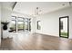 Airy living room with hardwood floors, lots of windows, and modern lighting at 8386 E Leaning Rock Rd, Scottsdale, AZ 85266