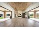 Expansive living space featuring a wood ceiling, marble fireplace, and seamless indoor-outdoor living at 8386 E Leaning Rock Rd, Scottsdale, AZ 85266