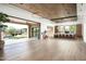Spacious living room open to the backyard and kitchen, with hardwood floors and modern design at 8386 E Leaning Rock Rd, Scottsdale, AZ 85266