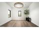 Spacious living room with hardwood floors, recessed lighting, and large windows with scenic desert views at 8386 E Leaning Rock Rd, Scottsdale, AZ 85266