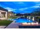 Backyard pool and spa featuring fire bowls, waterfall features, and desert views at 8386 E Leaning Rock Rd, Scottsdale, AZ 85266