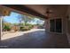 Spacious flagstone patio with built-in BBQ and desert landscaping at 19403 N Ponderosa Ct, Surprise, AZ 85387