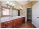 Bathroom with double vanity and walk-in closet at 19403 N Ponderosa Ct, Surprise, AZ 85387