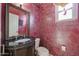 Powder room with dark vanity and unique walls at 19403 N Ponderosa Ct, Surprise, AZ 85387