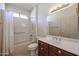 Bathroom with shower/tub combo, vanity, and linen closet at 19403 N Ponderosa Ct, Surprise, AZ 85387