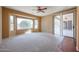 Bedroom with large window and patio access at 19403 N Ponderosa Ct, Surprise, AZ 85387