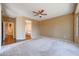 Bright bedroom with access to bathroom and hallway at 19403 N Ponderosa Ct, Surprise, AZ 85387