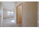 Bedroom with carpet flooring and access to bathroom at 19403 N Ponderosa Ct, Surprise, AZ 85387